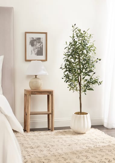 Kate and Laurel 5ft. Oliveira Faux Olive Tree in Claudel Scalloped Distressed White Planter
